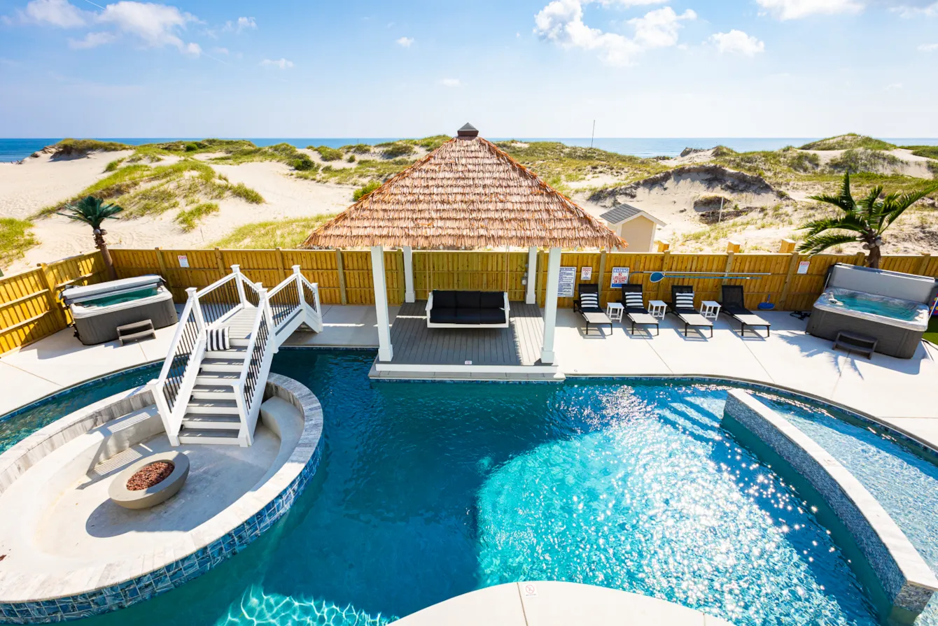 View of pool and covered patio area